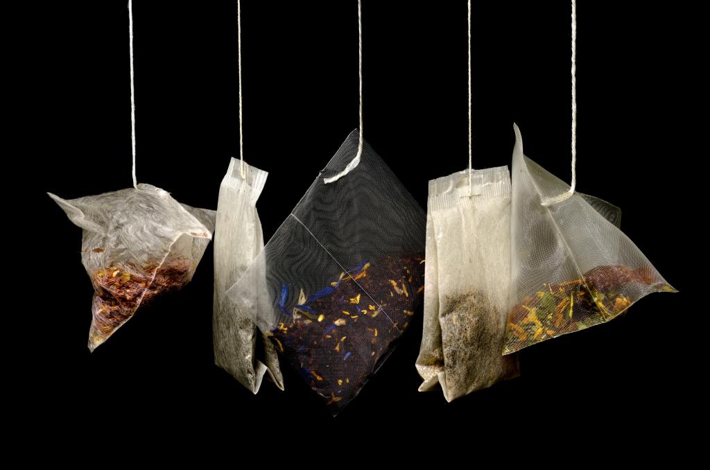 different tea bags hanging on strings